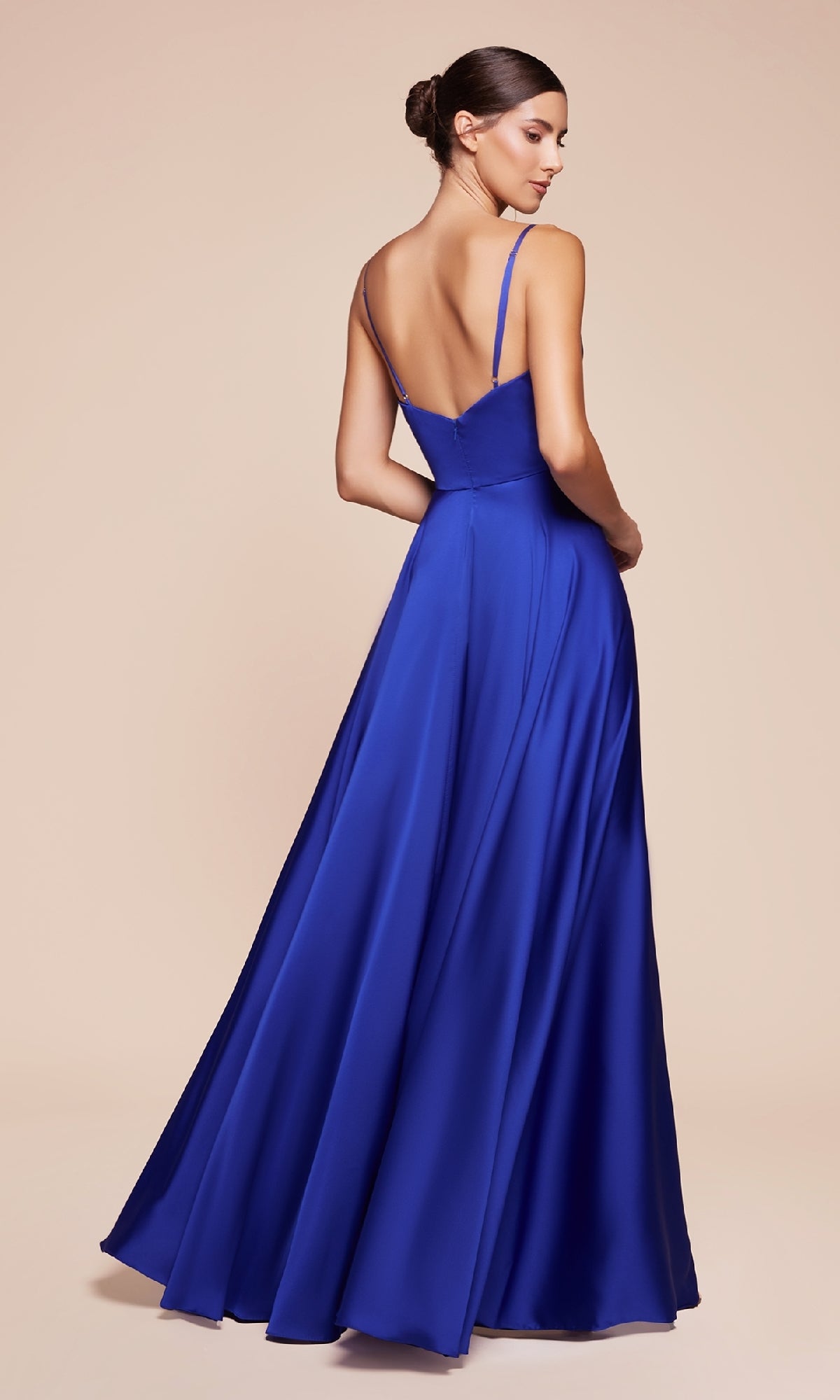 Woman in the Ladivine 7485-1 Classic A-Line Satin Prom Dress in royal blue, featuring thin straps and an open back, floor-length design, posed against a neutral background.